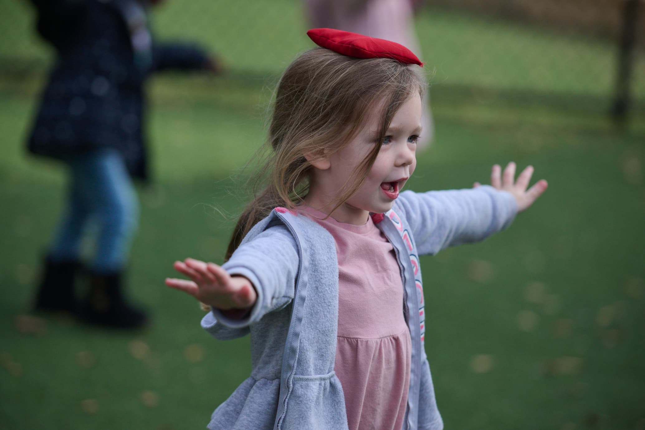 preschool child balancing a beanbag on their head